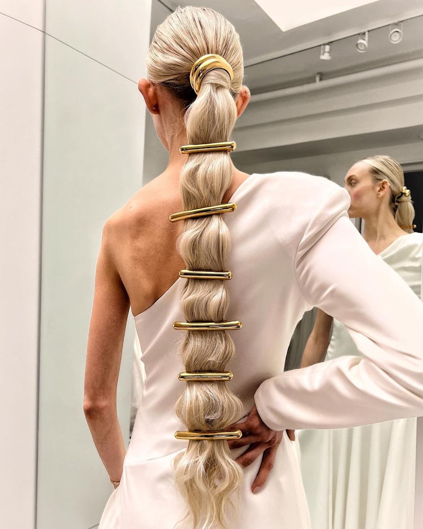 You’ll see lots of low ponytails bedazzled with accessories.