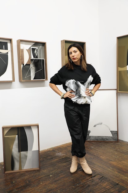 Sheree Hovsepian poses amongst her work at the International Art Exhibition.