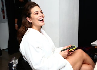 Ashley Graham prepares backstage during New York Fashion Week -- the model recently welcomed twins i...