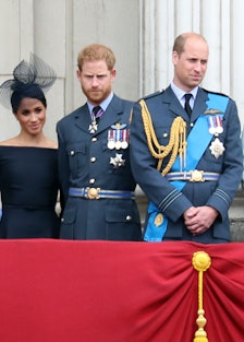 Queen Elizabeth II, Meghan Markle, Prince Harry, Prince William, and Kate Middleton on the balcony o...