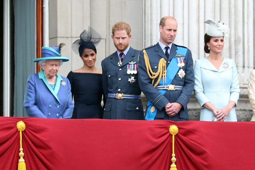 Queen Elizabeth II, Meghan Markle, Prince Harry, Prince William, and Kate Middleton on the balcony o...