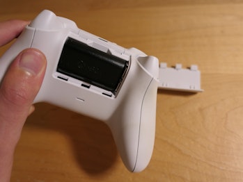 The Xbox controller with the battery cover removed.