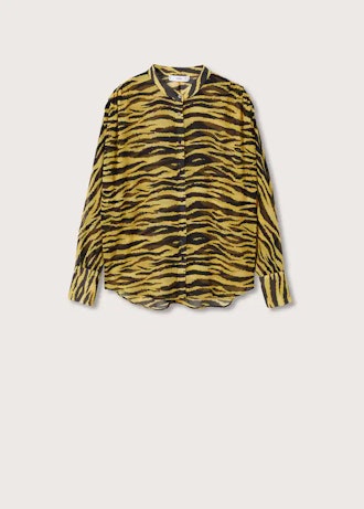 Recreate Chrissy Teigen's spring outfit with this tiger print blouse from Mango.