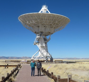 one dish of the vla with two scientists standing in front of it
