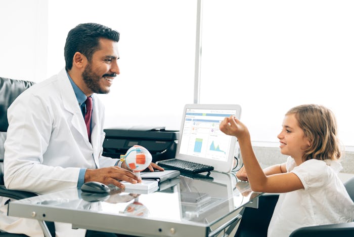 A child setting at the doctor during eye exam