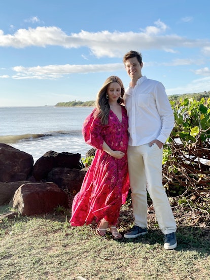 Laura, with her husband, wearing a Misa dress at five months pregnant 
