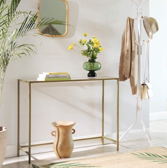 Narrow glass console table for maximizing entryway space