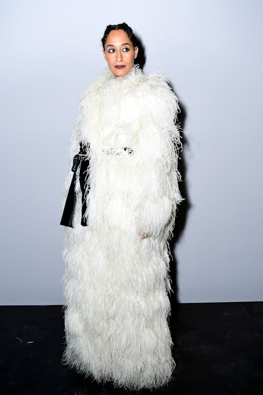 Tracee Ellis Ross wearing a white feather coat