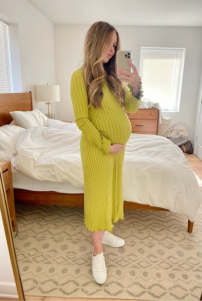Laura wearing a Simon Miller dress at seven months pregnant 