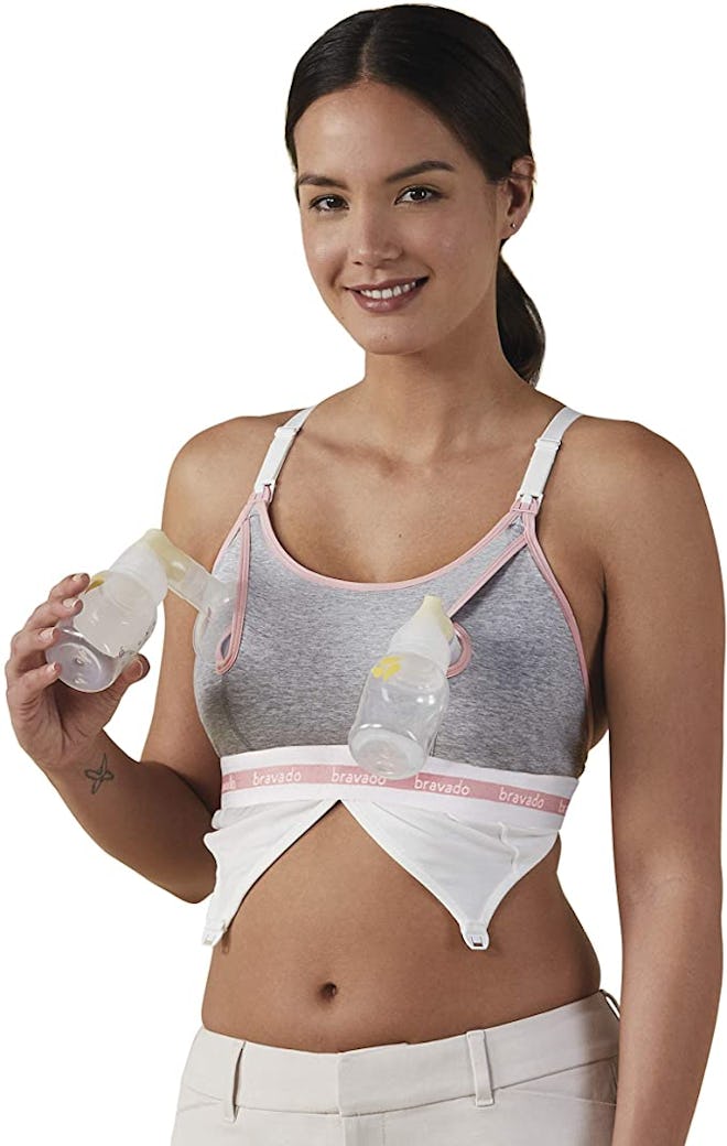 woman wearing a gray and pink exclusively pumping bra with flanges on