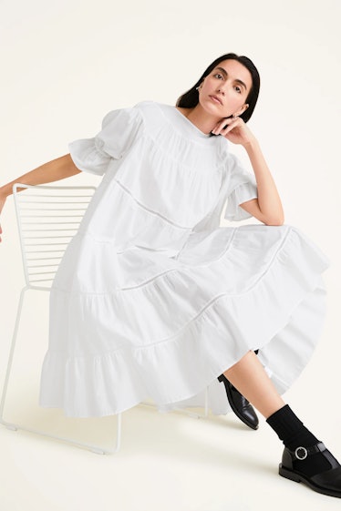 Non-Maternity Dress Brands Merlette white tiered dress with puff sleeves and cotton lace trim