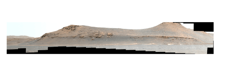 A long photograph that shows the landscape of Mars. The terrain looks pale brown and a little red. T...