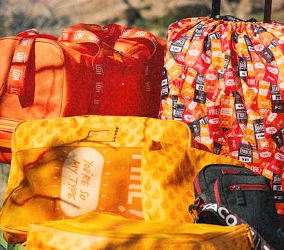 Calpak top red luggage