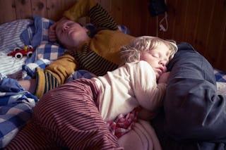 Sick and tired mom and child sleeping 