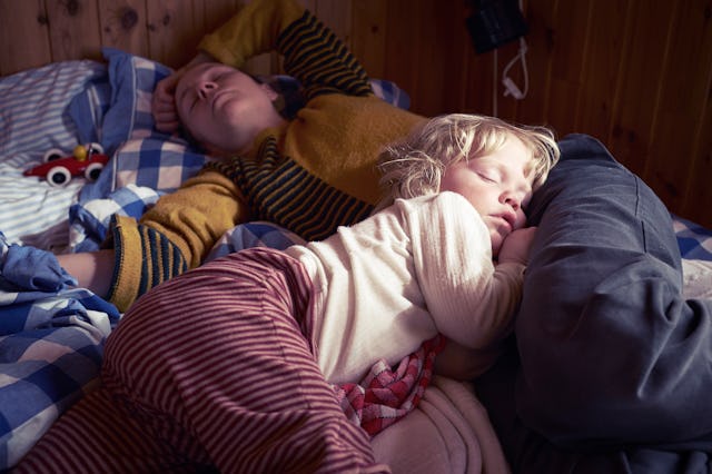 Sick and tired mom and child sleeping