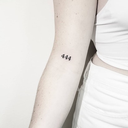 You could go with a more minimalist take on an angel number tattoo.