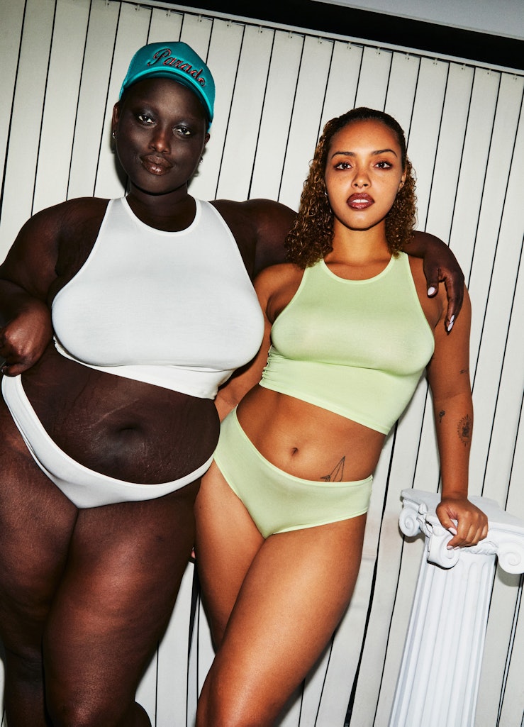 Two women wearing white and light green colored underwear posing for Parades collection