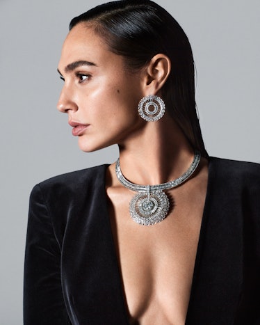 Gal Gadot in a black blazer and diamond necklace and earrings
