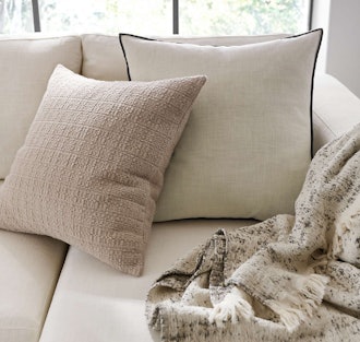 Knitted throw textured pillow cover for adding light neutral tones to your couch