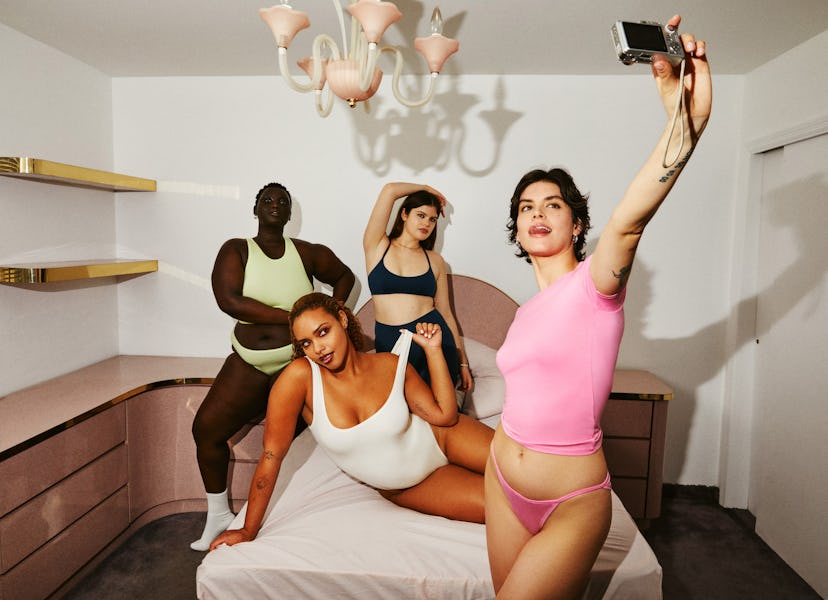 Four women wearing white, black, pink and light green underwear posing for Parades collection