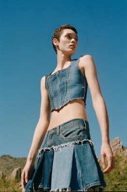 model wearing patchwork denim mini skirt