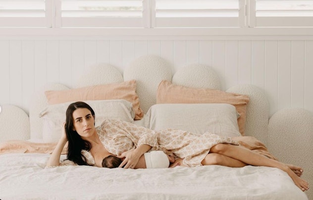breastfeeding photoshoot ideas on a bed