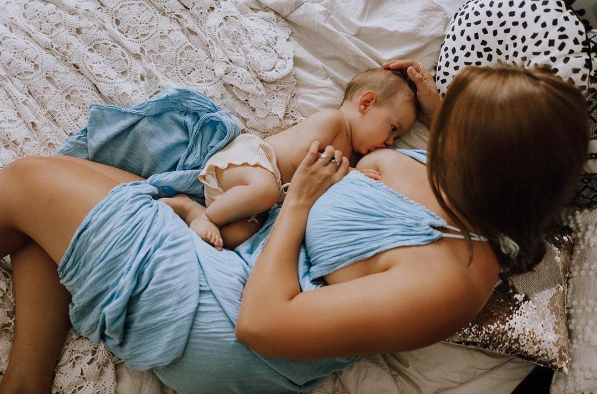 breastfeeding photoshoot ideas of mom and baby laying down
