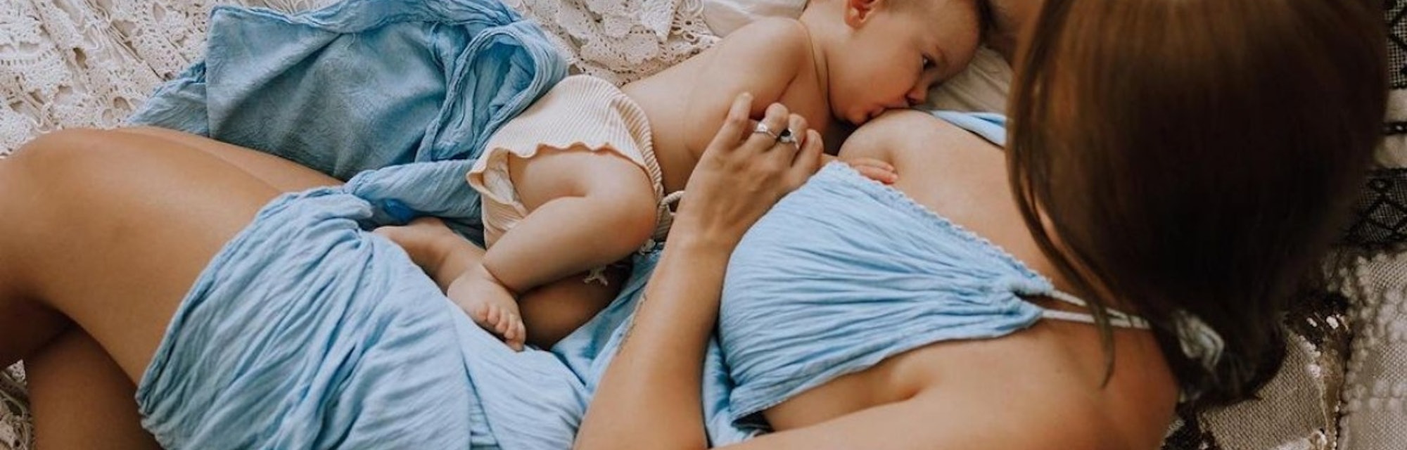 breastfeeding photoshoot ideas of mom and baby laying down