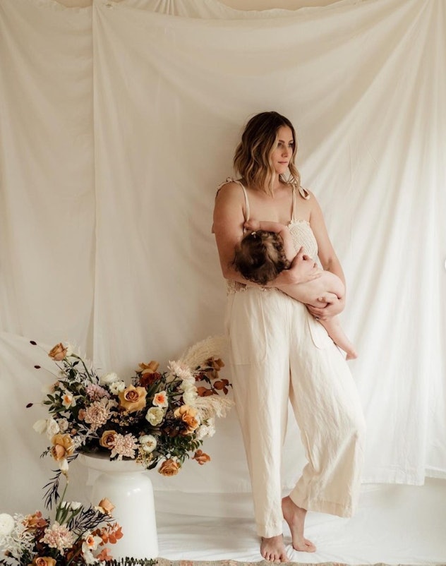 breastfeeding photoshoot ideas of mom and baby on white backdrop