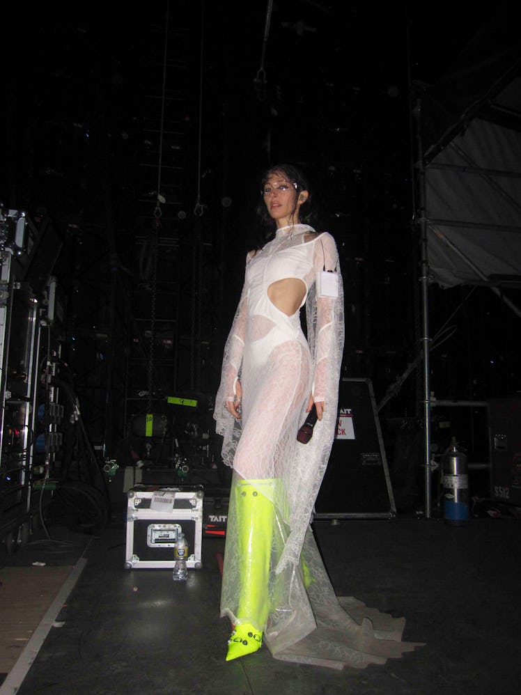Caroline Polachek in white Dion Lee dress and Balenciaga boots
