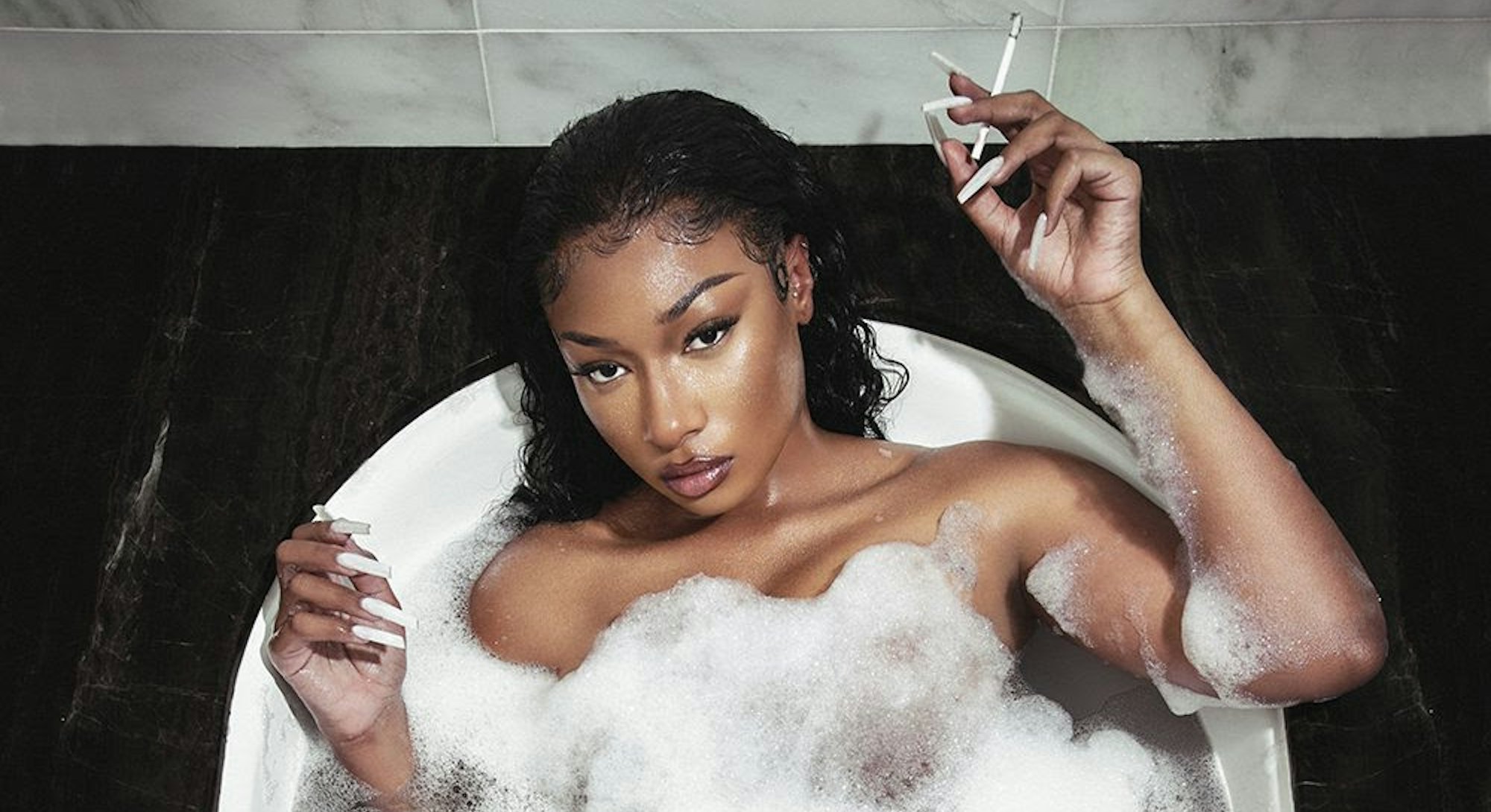 Cover of SOUNDCHECK featuring singer Megan Thee Stallion in a bathtub with a cigarette in her hand