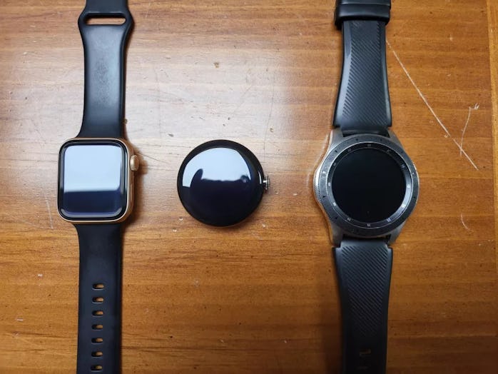 Prototype of Google Pixel smartwatch next to Apple Watch and Samsung Galaxy Watch