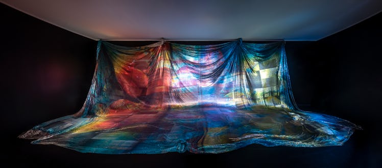 a shimmering curtain in a dark room