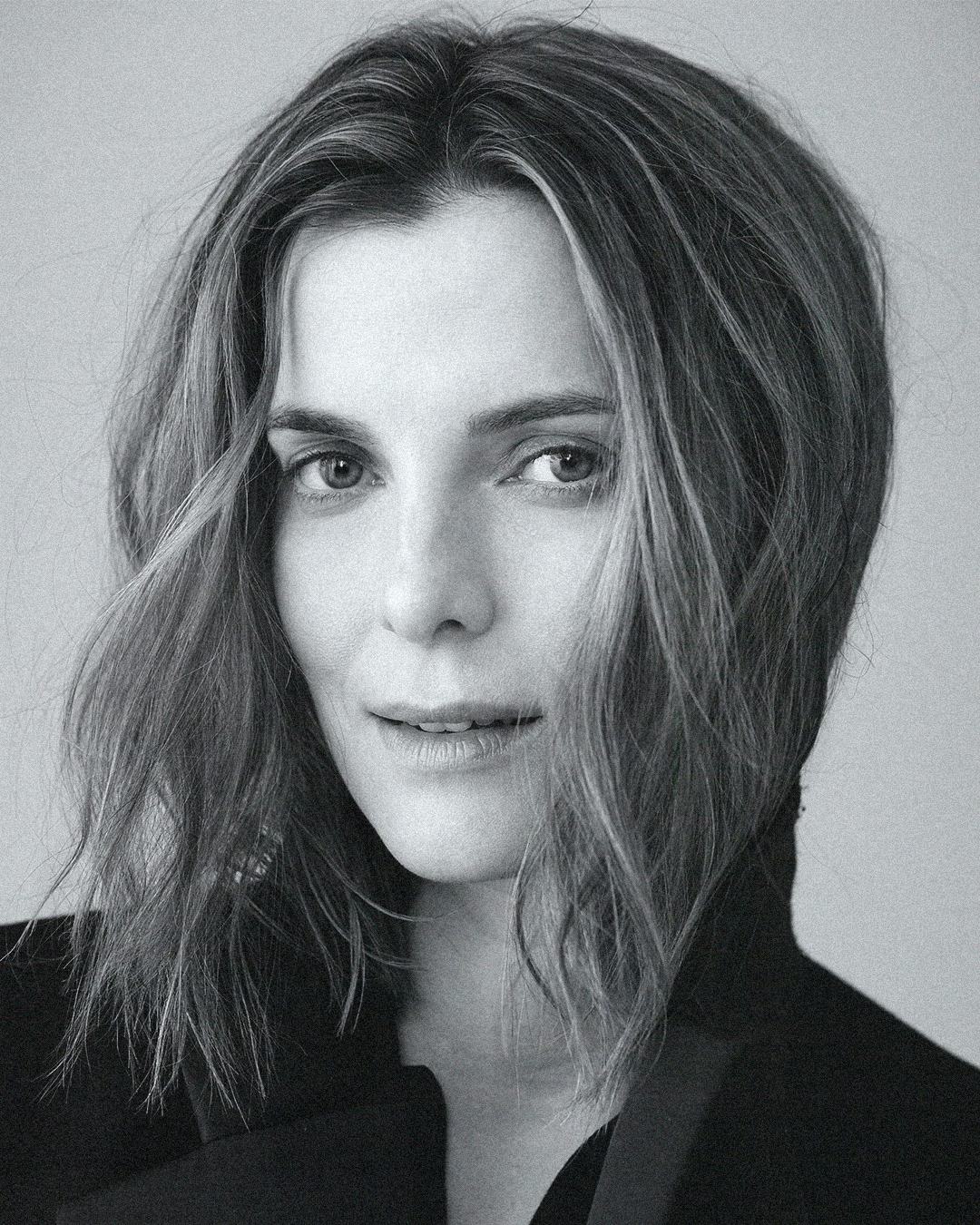 Portrait of Betty Gilpin in black and white.