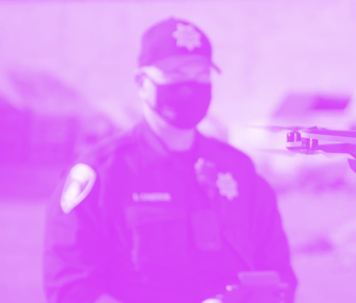 Cop wearing Covid mask piloting surveillance drone for surveillance company promo video