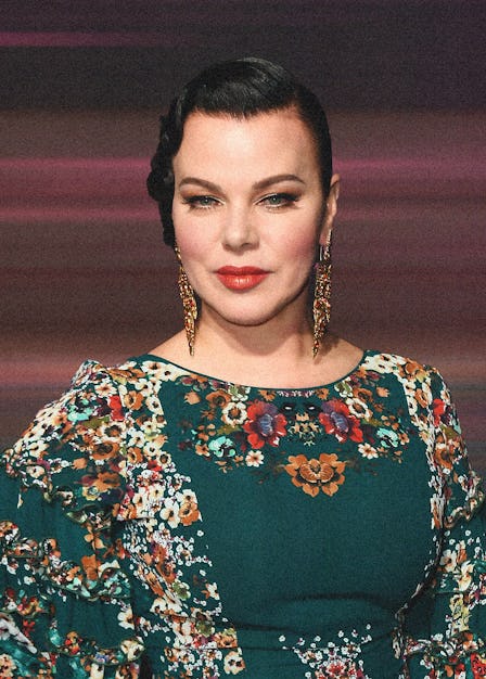 Debi Mazar wearing her hair pulled back and red lipstick