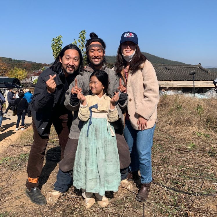 Hugh on set with the show’s other director, Kogonada, actor Leo Joo, and Yuna, who portrays a young ...