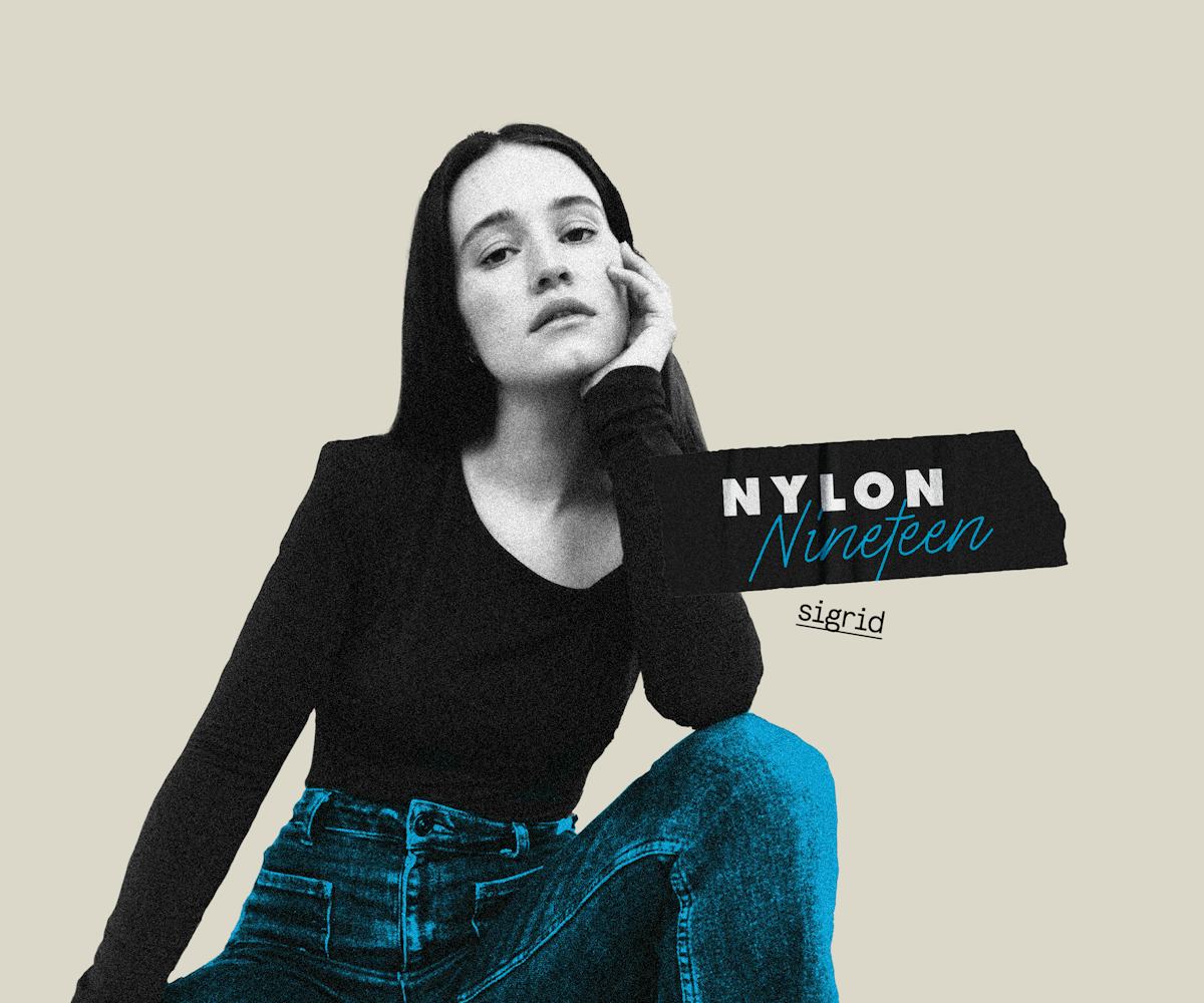 Norwegian singer and songwritter Sigrid wearing a black long sleeve shirt and blue pants talking abo...