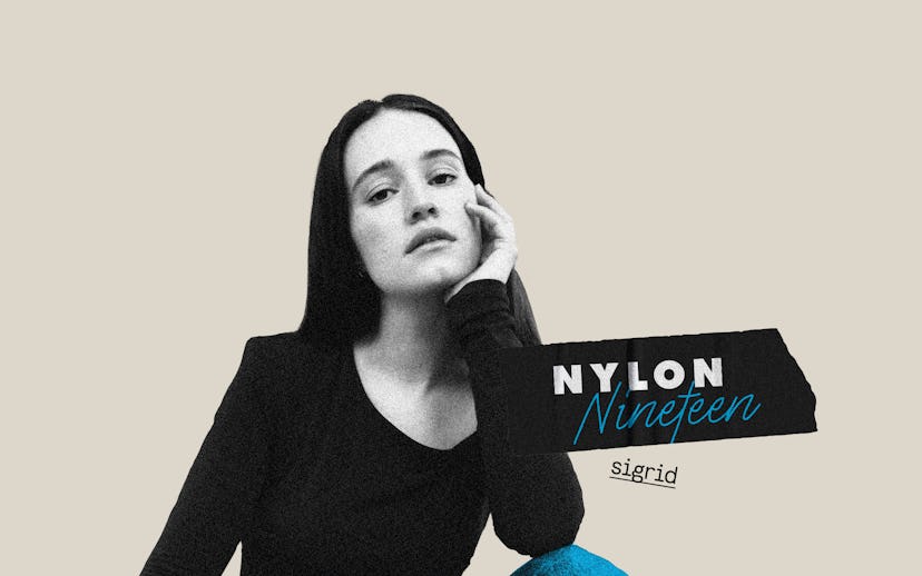 Norwegian singer and songwritter Sigrid wearing a black long sleeve shirt and blue pants talking abo...