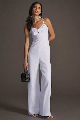 Snag this white bow-front jumpsuit from Hutch on Anthropologie to recreate Kate Hudson's spring outf...