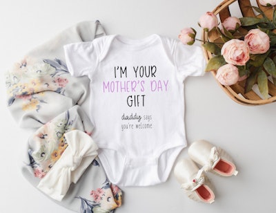 This onesie reads "I'm your Mother's Day Gift. Daddy says you're welcome," and makes a cute Mother's...