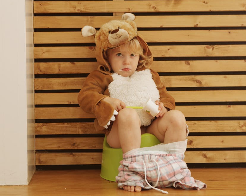 toddler sitting on potty, these potty training products can help