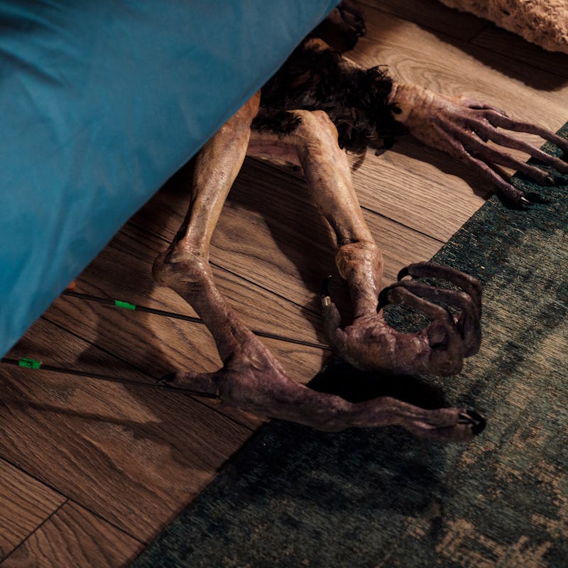 An insert with a creature under the bed in 'Hatching.'