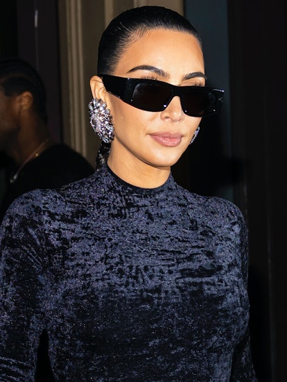 Kim Kardashian wears diamond statement earrings with black velvet dress