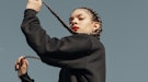 Young woman dancing and playing with her hair during the 2023 Black Moon.