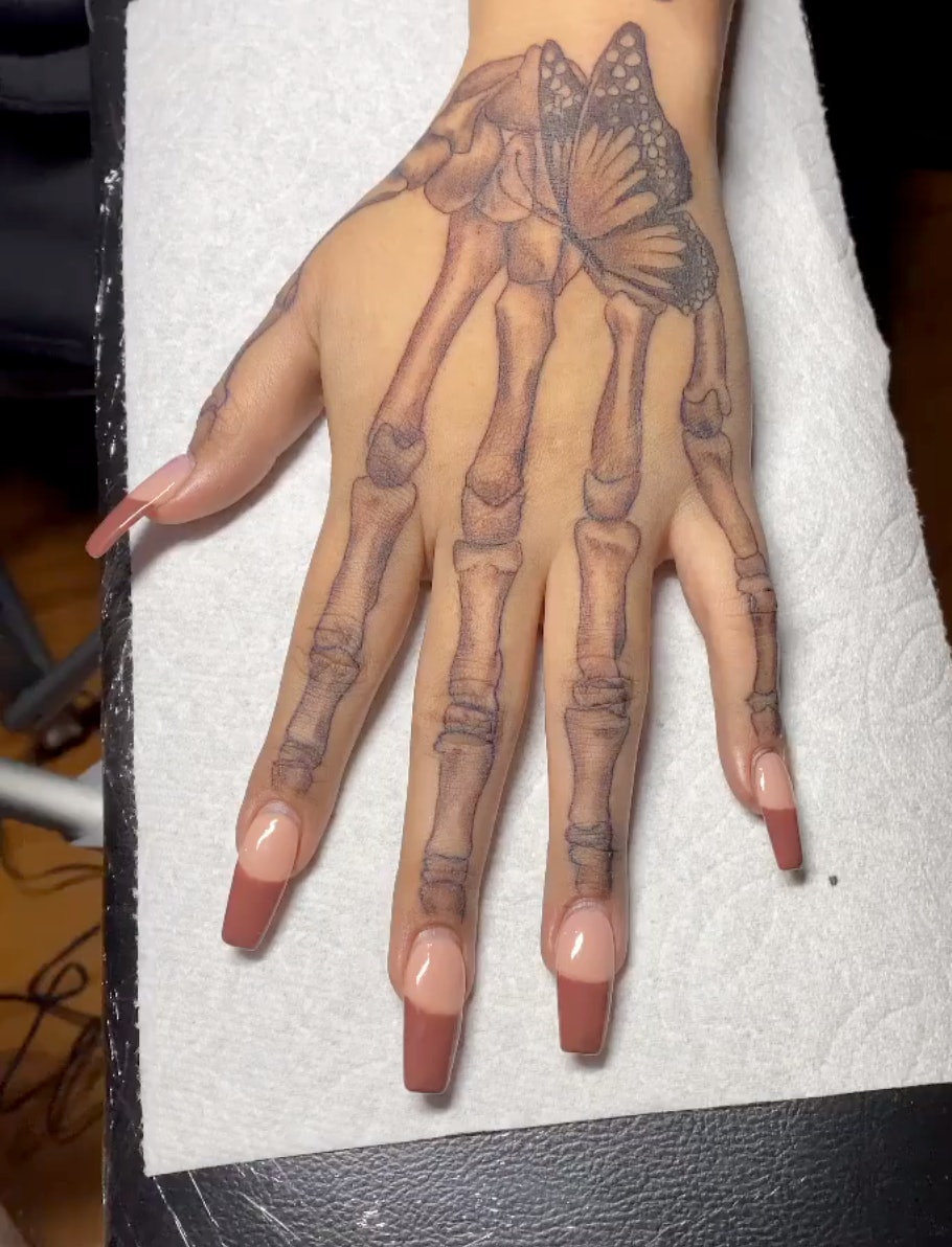 18 Terrifying and Cool Skeleton Hand Tattoos Design  Psycho Tats