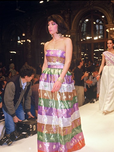 A model wearing a strapless Givenchy couture gown on the runway