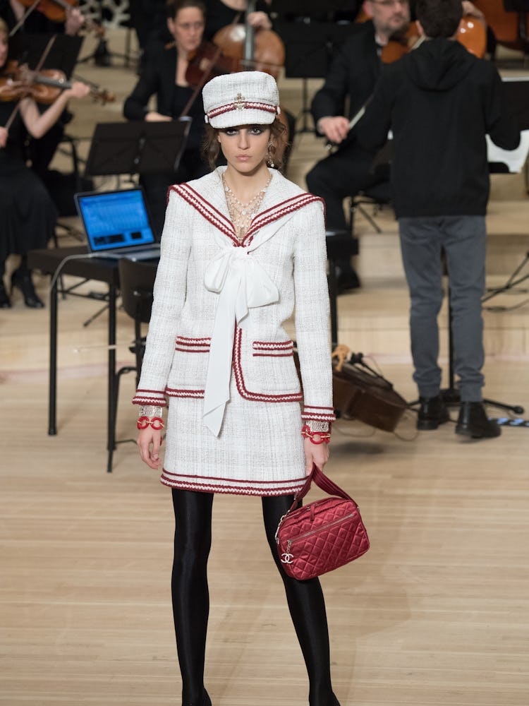 A model wearing a sailor-like Chanel ensemble on the runway