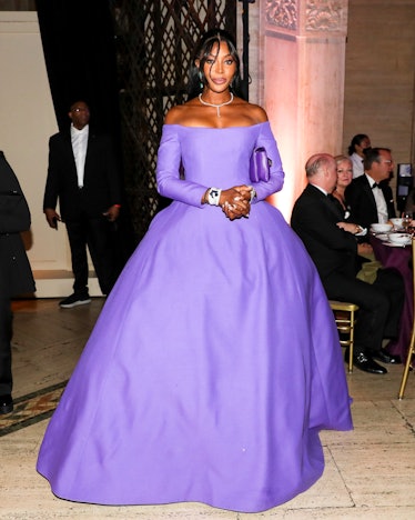 Naomi Campbell wearing a large purple Valentino gown