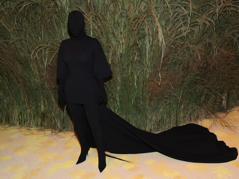 Kim Kardashian covered in head-to-toe black at the 2021 Met Gala, ahead of her 2022 red carpet appea...